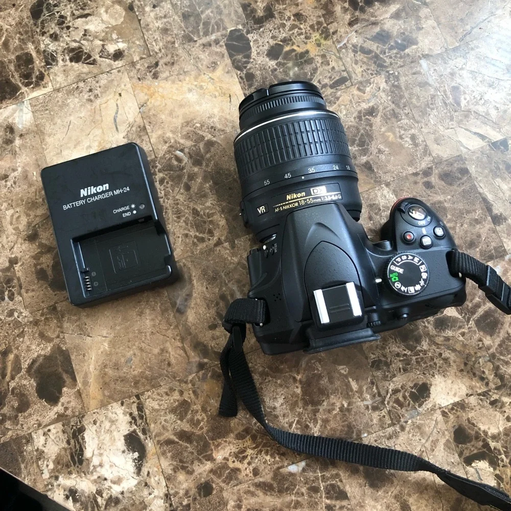 Nikon D3200, charger and case. Great digital camera for a present.